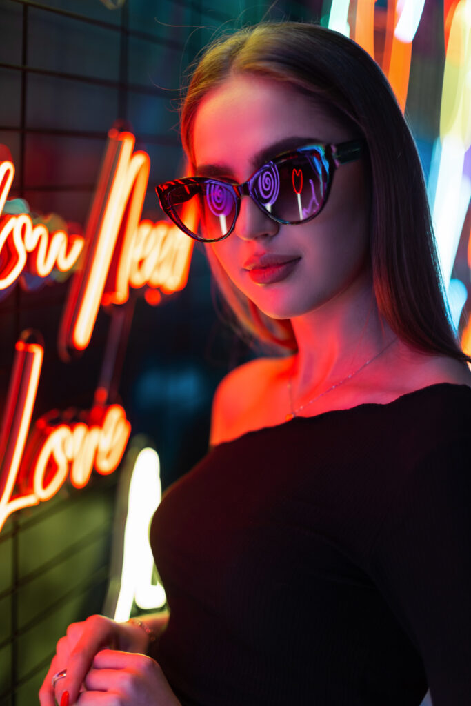 Cool female night portrait of a beautiful young woman model with